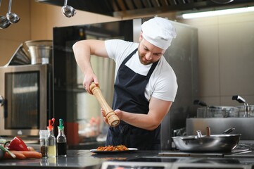 Smiling chef in his kitchen