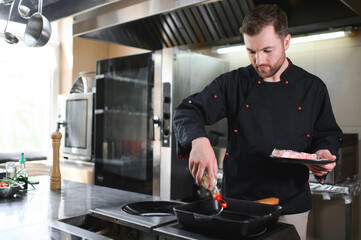 Smiling chef in his kitchen