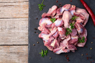 Raw chicken giblets gizzard ( stomach ) , meat background
