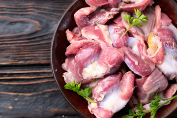 Raw chicken giblets gizzard ( stomach ) , meat background