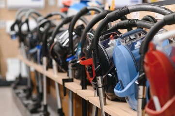 Obraz premium Appliances store presents for sale modern vacuum cleaners from different manufacturers