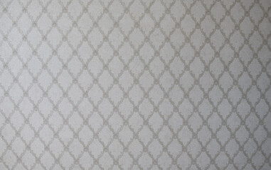 Old wallpaper on the wall. Old wallpaper for texture or background.