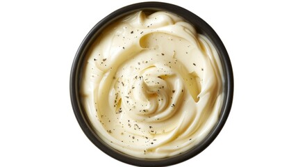 A bowl filled with creamy mayonnaise sitting on a clean white surface