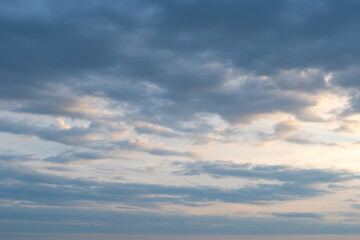 evening sky with clouds and rays of the sun, background