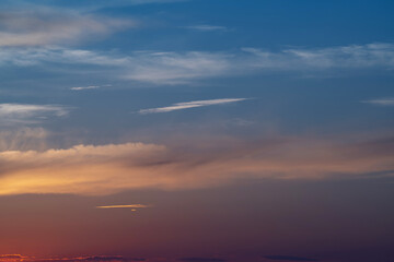 evening sky with clouds and rays of the sun, background