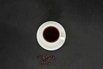 Espresso Americano in a ceramic fancy cup with fresh coffee bean scattered Isolated White Background
