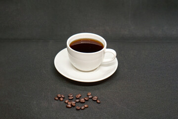 Espresso Americano in a ceramic fancy cup with fresh coffee bean scattered Isolated White Background