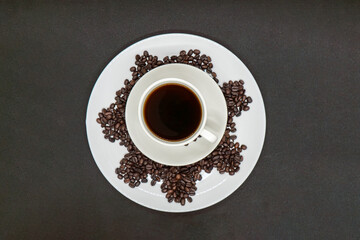 Espresso Americano in a ceramic fancy cup with fresh coffee bean scattered Isolated White Background