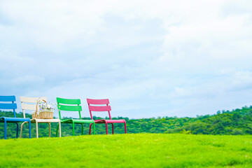 Colorful chairs on the mountain, beautiful view