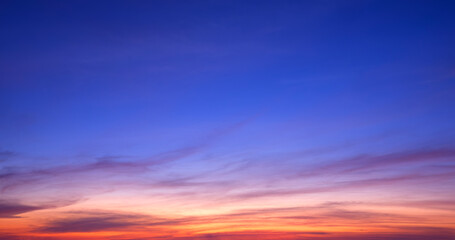 Fototapeta premium Colorful twilight sky background with streak clouds on beautiful dusk sky after sundown