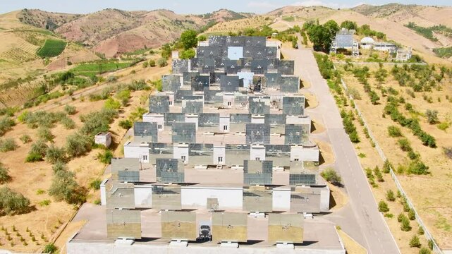 Parkent, Uzbekistan - 10th november, 2023: The solar furnace of Uzbekistan acting as a parabolic reflector. Institute of the sun and Physics of the sun.