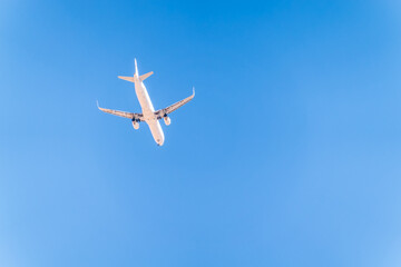 Airplane before landing in blue sky, Airbus A321-200