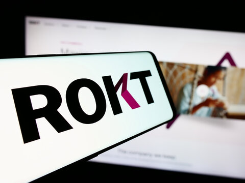 Stuttgart, Germany - 07-14-2024: Mobile phone with logo of e-commerce technology company Rokt Pte. Ltd. in front of business website. Focus on center-left of phone display.