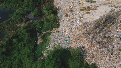 Garbage Vs Nature Stark Contrast. 
Mountains Of Trash Aerial.