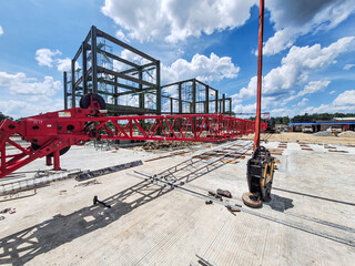 Selective focus. Engineers and manual workers are working on a construction site of a new waste plant. Construction site of a building. Indonesia.