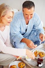 Elderly couple, bedroom and food for diet, breakfast and wellness for retirement health. Mature woman, man and croissant or muffin with fruit juice for romance, nutrition and senior care or support