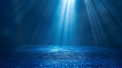 Fototapeta premium Blue light beams shining through water, creating a serene underwater scene.