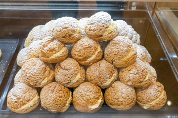 Delicious handmade puffs of the day are displayed on the counter