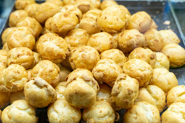 Delicious handmade puffs of the day are displayed on the counter