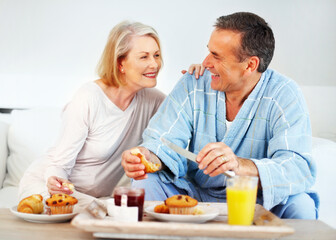 Senior couple, bedroom and food for wellness, breakfast and nutrition for retirement health. Mature woman, man and croissant or muffin with fruit jam for diet, romance and elderly care or support