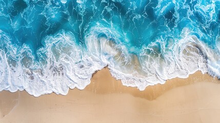 Fototapeta premium Blue ocean wave on sandy beach with space for text and design