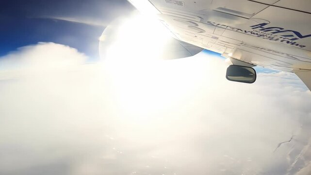 View from an airplane window of a mushroom cloud rising upward.
Concept: nuclear explosion or plane crash, destruction and apocalypse