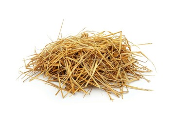 A pile of hay sits atop a white surface, with no additional context