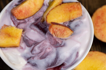natural yogurt in a white bowl with fruits