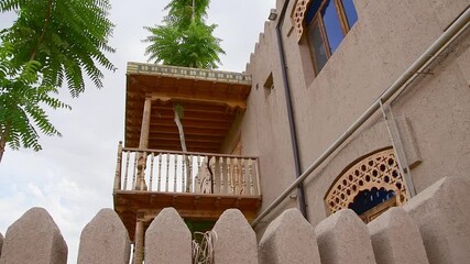 Khiva, Uzbekistan - 15th september, 2023: traditional islamic balcony and local house. Itchan Kala.Khiva old city sightseeing landmark. Unesco world heritage site