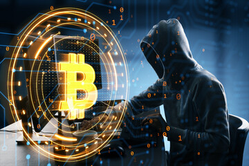 Person in a hoodie with the Bitcoin symbol overlay, coding on a computer in a digital environment.