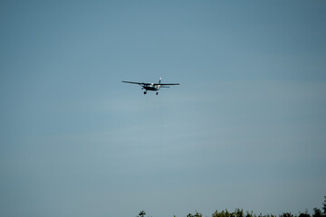 Cessna Grand Caravan G-BZAH blue and white fixed wing aircraft on final approach to landing