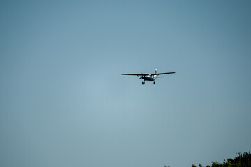 Cessna Grand Caravan G-BZAH blue and white fixed wing aircraft on final approach to landing