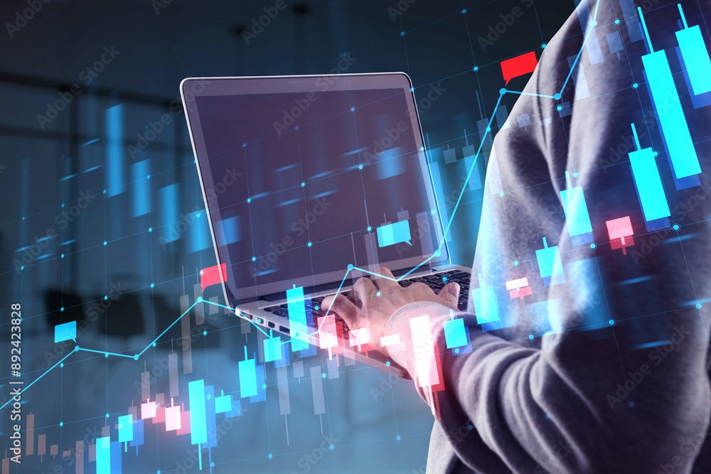 Poster a person using a laptop with a double exposure of financial charts creates a fusion of technology an