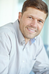 Obraz premium Portrait, happy and man in office for business, working and pride for career in law firm. Smile, consultant or lawyer and job in agency or company with confidence for advisory and expert in workplace