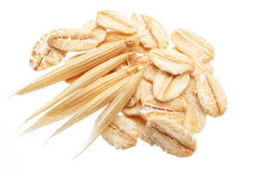 Dry oat plant florets and oat flakes isolated on white background. Macro shoot.