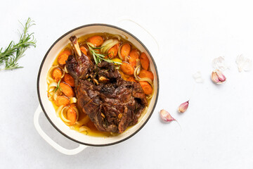 Lamb shoulder braised in a cast iron pan