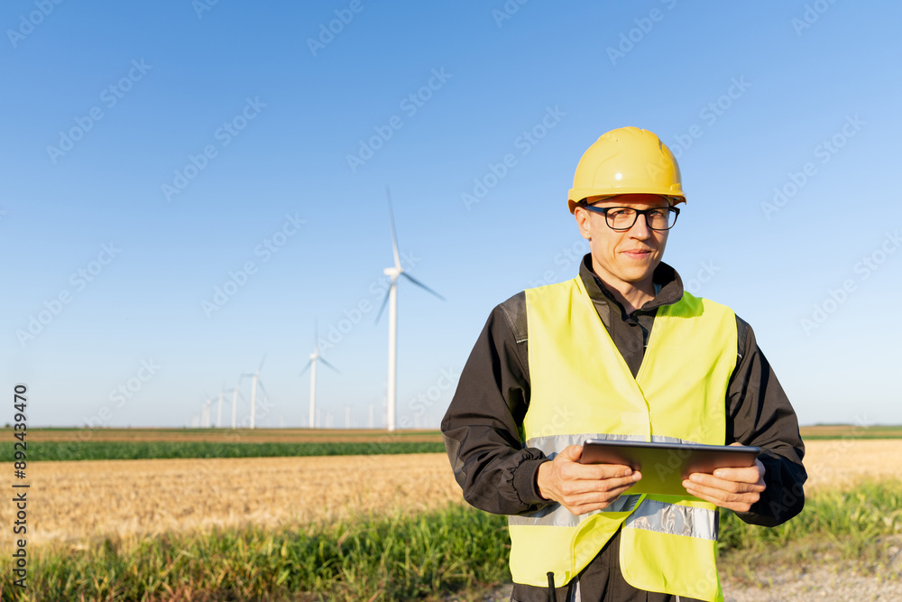 Aufkleber engineer with digital tablet controls wind turbines