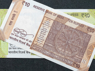 Closeup of an Indian new currency 20 and 10 rupees note back sides