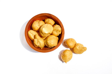Dry Soes Cake in a small wooden bowl isolated on white background