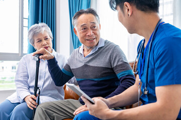 Senior couple got medical service visit from caregiver nurse at home while having result of medical exam for health care and pension welfare insurance