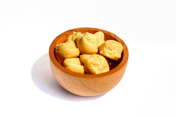 Dry Soes Cake in a small wooden bowl isolated on white background
