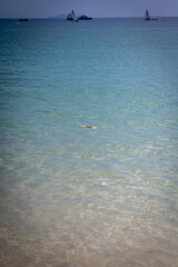 Toy spade on the sea