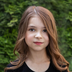 Fototapeta premium Close up fashion portrait of a beautiful girl with makeup and hairstyle outdoors