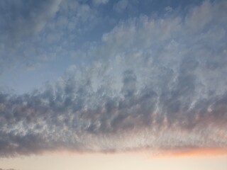 Textures of velvet blue clouds in the sky.
