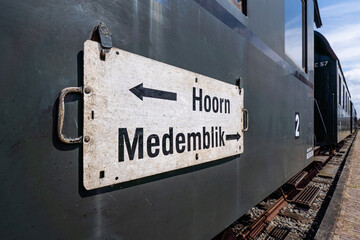 train destination sign on heritage railway carriage (service between the Dutch cities Hoorn and...