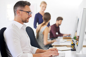 Obraz premium Businessman, online and typing with computer in office for campaign planning, update media contact and project. Public relations employee, reading and working on technology for research market trends