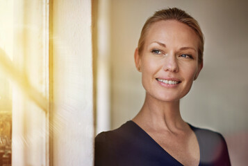 Business woman, smile and thinking by window for future career ideas, decision and memory in...
