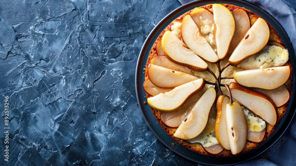 Fototapete gourmet pear and gorgonzola cake with pear slices on a deep blue background, sophisticated and perfe