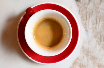 Cup with espresso black coffee, top view