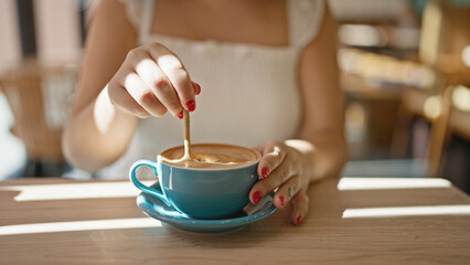 Cafe bliss, young woman enjoys leisurely coffee break, reveling in the sunny interior of a...